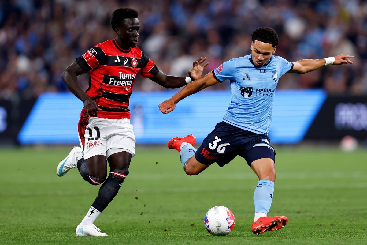 Rhys Youlley of Sydney FC competes with Atiya Waraga of the Wanderers at Allianz Stadium.