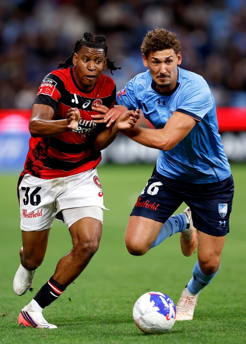 Panashe Madanha of the Wanderers competes with Gabriel Popovic of Sydney FC at Allianz Stadium.