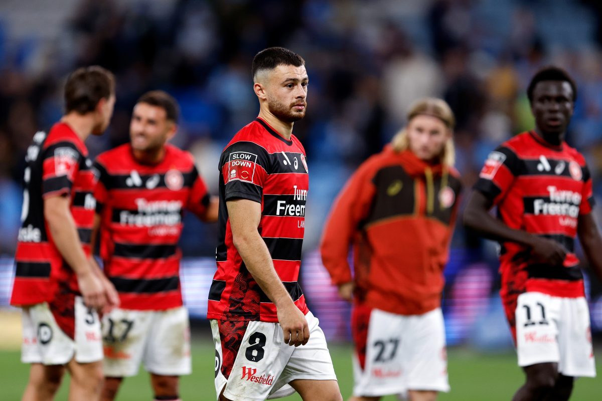 Wanderers players react at full-time at Allianz Stadium.