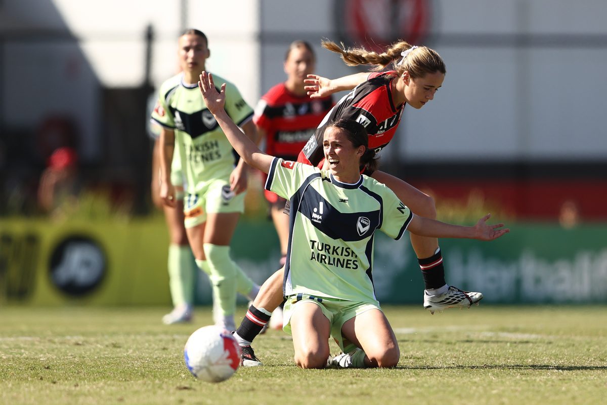 Alicia Woods of the Victory is tackled at Wanderers Football Park.