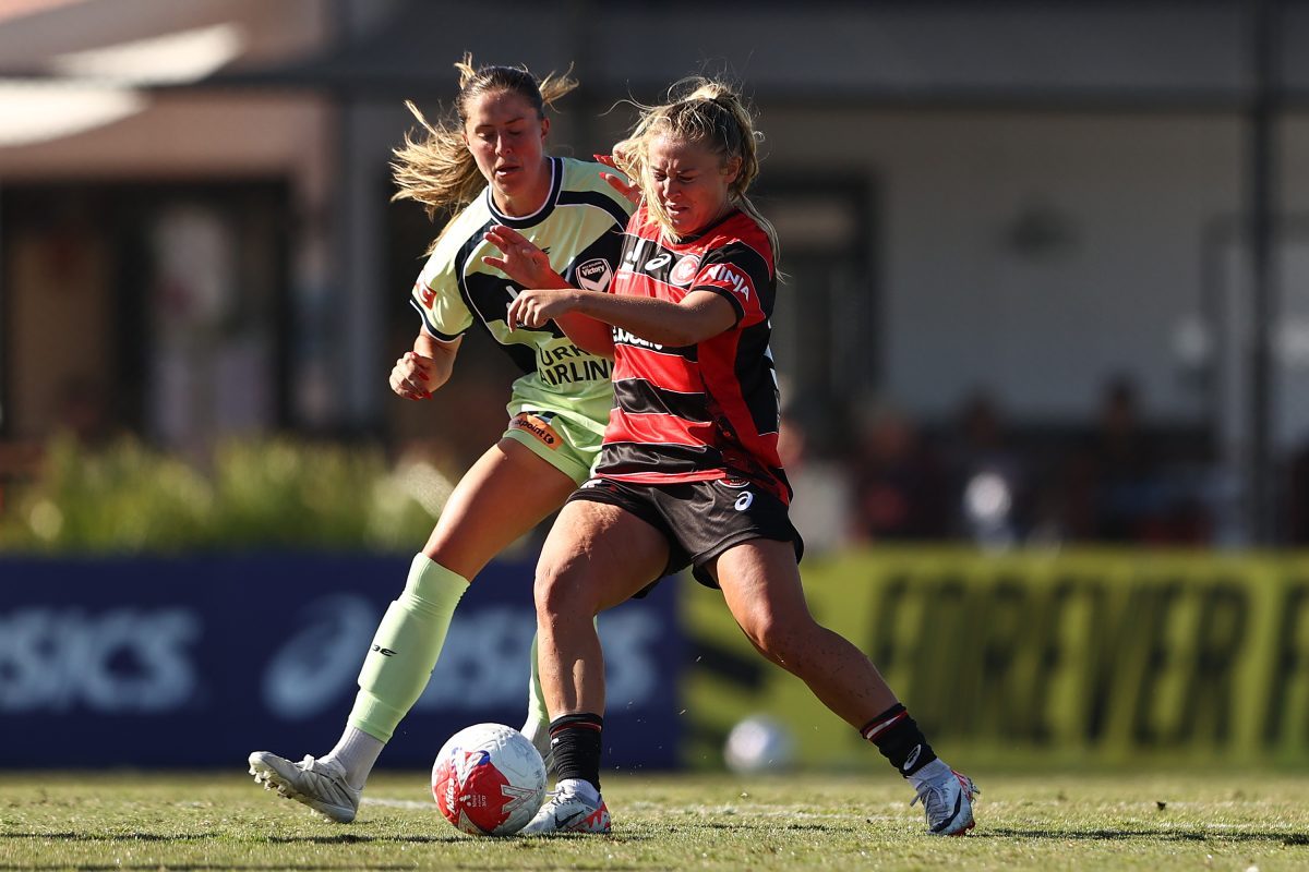 Brooke Miller of the Wanderers is tackled at Wanderers Football Park.