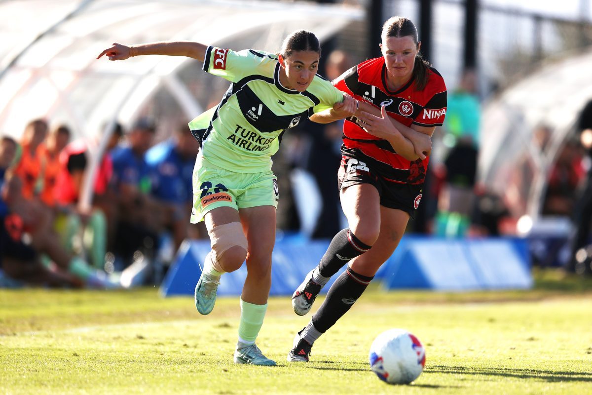 Sienna Techera of the Victory is challenged by Laura Pickett of the Wanderers at Wanderers Football Park.