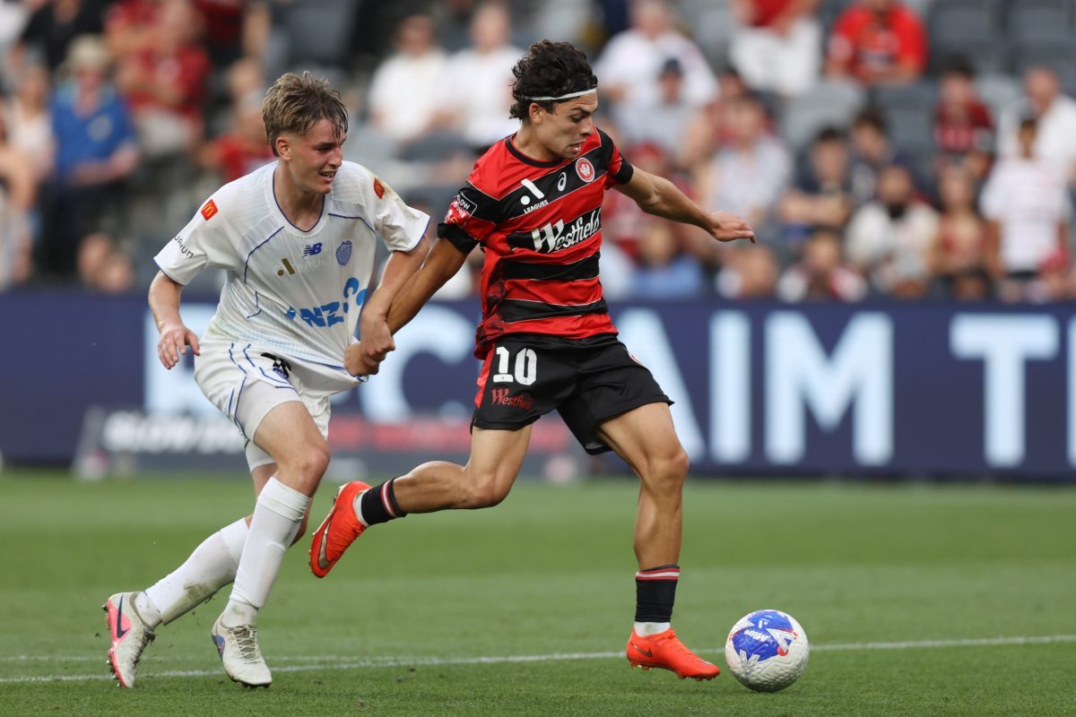 Miguel Di Pizio of the Wanderers is challenged by Luka Vicelich of Auckland FC at CommBank Stadium.