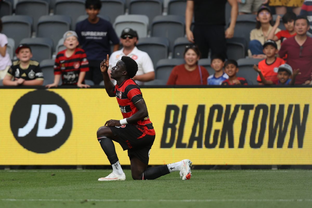 Atiya Waraga of the Wanderers celebrates scoring his teams fifth goal at CommBank Stadium.
